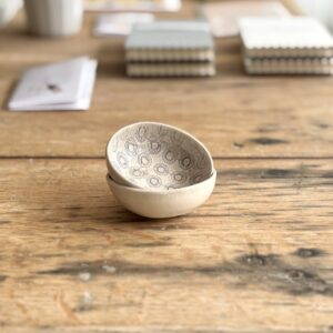 Unique handcrafted pottery with grey pattern variations